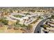 Close aerial shot of property featuring a courtyard, ample parking, and playground at 2770 W Kent Dr, Chandler, AZ 85224