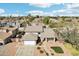 Aerial view of a two-story home with a two-car garage, a manicured lawn, and mature trees at 2770 W Kent Dr, Chandler, AZ 85224