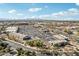 Aerial view of a parking area, busy roads, commercial buildings and desert landscape under a blue sky at 2770 W Kent Dr, Chandler, AZ 85224