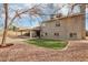 Backyard features an outdoor oasis, featuring low-maintenance gravel, an artificial lawn and shade trees at 2770 W Kent Dr, Chandler, AZ 85224