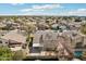 A nice home backyard with a covered patio, xeriscaping, block wall, and green shrubbery at 2770 W Kent Dr, Chandler, AZ 85224