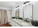 Bathroom featuring double sinks, granite counters, modern fixtures, and a shower-tub combo at 2770 W Kent Dr, Chandler, AZ 85224