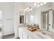 Bright bathroom with a double sink vanity and bright lighting at 2770 W Kent Dr, Chandler, AZ 85224