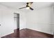 Bedroom featuring wood floors, ceiling fan, and a closet for ample storage at 2770 W Kent Dr, Chandler, AZ 85224