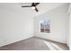 Bright bedroom with vaulted ceiling, fan, and neutral carpet at 2770 W Kent Dr, Chandler, AZ 85224