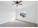 Bedroom with carpet, a ceiling fan, and a window showcasing the outside view at 2770 W Kent Dr, Chandler, AZ 85224