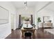 Dining area with wooden table and chairs, hardwood floors, and ample light at 2770 W Kent Dr, Chandler, AZ 85224