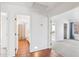 Hallway showcasing access to bathroom with tile floor and a bedroom with carpet at 2770 W Kent Dr, Chandler, AZ 85224