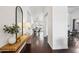 Bright hallway featuring hardwood floors and a view into the dining room at 2770 W Kent Dr, Chandler, AZ 85224