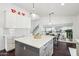 Contemporary kitchen with island, white cabinets, and stainless steel appliances at 2770 W Kent Dr, Chandler, AZ 85224