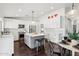 Modern kitchen with white cabinets, stainless steel appliances, and gray island at 2770 W Kent Dr, Chandler, AZ 85224