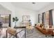 Stylish living room featuring hardwood floors, a comfortable sofa, and natural light at 2770 W Kent Dr, Chandler, AZ 85224