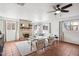 Bright living room featuring a brick fireplace, tile floors, and abundant natural light at 2770 W Kent Dr, Chandler, AZ 85224