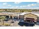 An aerial view of a shopping center with diverse businesses and well-maintained landscaping at 2770 W Kent Dr, Chandler, AZ 85224