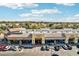 An aerial view of a shopping center featuring various stores and ample parking under a clear blue sky at 2770 W Kent Dr, Chandler, AZ 85224