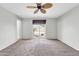 Bright bedroom with view of backyard pool through sliding glass door at 3060 W Roberta Dr, Phoenix, AZ 85083