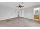 Spacious bedroom with neutral carpet and ceiling fan at 3060 W Roberta Dr, Phoenix, AZ 85083