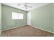 Neutral bedroom with carpet, window and overhead lighting at 3060 W Roberta Dr, Phoenix, AZ 85083
