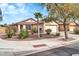 Single Gathering home featuring desert landscaping, paver walkway, shade trees, and a two car garage at 3060 W Roberta Dr, Phoenix, AZ 85083