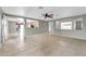 View from living room showcasing tile flooring, gray walls, and open access to the kitchen and dining area at 3060 W Roberta Dr, Phoenix, AZ 85083