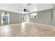Open living room featuring tile floors, neutral colored walls, and a ceiling fan at 3060 W Roberta Dr, Phoenix, AZ 85083