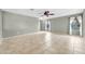Large living room area featuring tile flooring, neutral colored walls, and abundant natural light at 3060 W Roberta Dr, Phoenix, AZ 85083