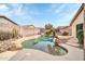 Backyard pool with rock features and desert landscaping at 3060 W Roberta Dr, Phoenix, AZ 85083