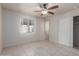 Bedroom with tile flooring, ceiling fan, and closet at 3238 E Cholla St, Phoenix, AZ 85028