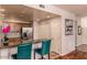 Kitchen featuring a granite counter with a stainless steel refrigerator and tile backsplash at 33550 N Dove Lakes Dr # 2030, Cave Creek, AZ 85331