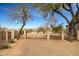 A simple backyard is enclosed with a metal fence at 34242 N 10Th St, Phoenix, AZ 85085