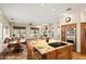 Open-concept kitchen featuring a granite island with cooktop and seating for four at 34242 N 10Th St, Phoenix, AZ 85085