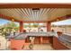 Inviting outdoor kitchen featuring a covered dining area and stainless steel grill at 34242 N 10Th St, Phoenix, AZ 85085