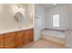 Bathroom showcasing a vanity with sink and soaking tub with tile accents at 36212 W Hadley St, Tonopah, AZ 85354