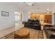 Spacious living room with tile floors, a ceiling fan, and multiple doorways at 36212 W Hadley St, Tonopah, AZ 85354