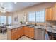 Well-lit kitchen featuring stainless steel appliances, tile floors and granite countertops at 40746 N Boone Ln, Anthem, AZ 85086