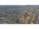 Panoramic aerial view showcasing a community nestled in a lush desert landscape with mountain and golf course views at 40915 N 107Th Pl, Scottsdale, AZ 85262