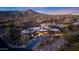 Aerial view of desert property with elegant design, landscaping, and mountain backdrop at 40915 N 107Th Pl, Scottsdale, AZ 85262