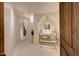 Unique bathroom with arched features, an ornate mirror, modern sink and a decorative pendant light at 40915 N 107Th Pl, Scottsdale, AZ 85262