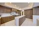 Contemporary kitchen features custom wood cabinets, a marble countertop island, and high-end stainless steel appliances at 40915 N 107Th Pl, Scottsdale, AZ 85262