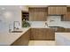 Stylish kitchen with sleek cabinets, marble countertops, a modern sink, and stainless steel appliances at 40915 N 107Th Pl, Scottsdale, AZ 85262