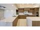 Well-appointed kitchen with marble countertops, custom cabinetry, and state-of-the-art stainless steel appliances at 40915 N 107Th Pl, Scottsdale, AZ 85262