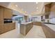 Modern kitchen with sleek cabinets, a large island, stainless steel appliances, and an open layout at 40915 N 107Th Pl, Scottsdale, AZ 85262