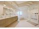 Luxurious main bathroom with dual vanity, soaking tub, and glass shower at 40915 N 107Th Pl, Scottsdale, AZ 85262