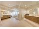 Bright main bathroom with dual vanities, soaking tub, and glass-enclosed shower at 40915 N 107Th Pl, Scottsdale, AZ 85262