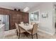 Dining area with a marble table, seating for six, and a modern chandelier with large pantry storage at 41737 W Cribbage Rd, Maricopa, AZ 85138