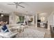 Open living space features comfortable white sofa, decorative pillows, and views of the outdoor spaces at 41737 W Cribbage Rd, Maricopa, AZ 85138