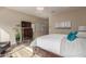 Spacious main bedroom with hardwood floors, ample natural light, accent lighting, and contemporary design at 41737 W Cribbage Rd, Maricopa, AZ 85138