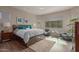 Main bedroom with accent lighting, new hardwood flooring, a large window, and sitting area at 41737 W Cribbage Rd, Maricopa, AZ 85138