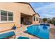 Gorgeous pool and spa with an outdoor seating area creates a resort-like experience in the backyard at 41737 W Cribbage Rd, Maricopa, AZ 85138