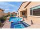 Beautiful backyard pool and spa with a private patio, perfect for outdoor relaxation and entertainment at 41737 W Cribbage Rd, Maricopa, AZ 85138